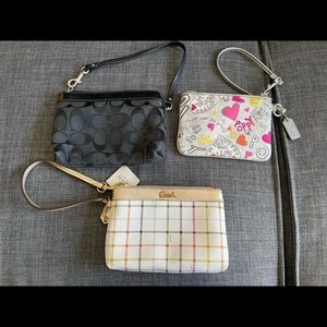 3 Coach wristlets